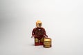 Mini lego figure of the Iron Man on a white background with his hat down