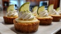 Mini lemon tarts with a biscuit base, decorated with whipped cream, lemon and mint Royalty Free Stock Photo