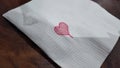 Mini love symbol on tissue paper