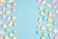 Mini marshmallows on trendy pastel blue background