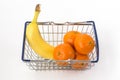 Mini metal shopping basket with banana and clementines