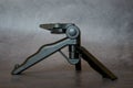 Mini Mobile and camera tripod isolated on a gray background. Compact tripod for travel and trips Royalty Free Stock Photo