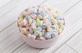 Mini Mochi Rice Cake Candies in a Pink Bowl on a White Wooden Table