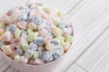 Mini Mochi Rice Cake Candies in a Pink Bowl on a White Wooden Table