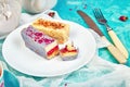 Mini Mousse Cake with chocolate, covered with blue spray and decorated with pink roses with cups of tea Royalty Free Stock Photo
