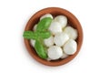 Mini mozzarella balls with basil in a ceramic bowl isolated on white background. Top view. Flat lay. Royalty Free Stock Photo