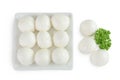 Mini mozzarella balls with parsley in a ceramic bowl isolated on white background. Top view. Flat lay. Royalty Free Stock Photo