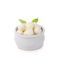 mini mozzarella cheese balls in small bowl with basil isolated on white Royalty Free Stock Photo