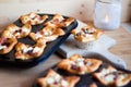 Mini muffin pizza freshly baked on a wooden cutting board Royalty Free Stock Photo