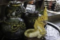 Mini Naga sculpture in garden bowl