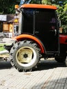 Mini orange tractor in outdoor