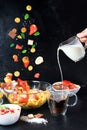 Mini pancake bowl for cereals with fresh strawberries, banana, chocolate, coconut mint. the tendency to self-isolation. levitation