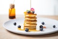 mini pancakes stack with a syrup drizzle Royalty Free Stock Photo