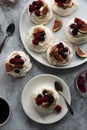 Mini Pavlova meringue cakes decorated with berries and figs Royalty Free Stock Photo