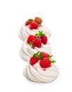 Mini Pavlova meringue nests with berries and mint on isolated o