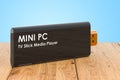 Mini PC TV Dongle Stick on the wooden planks, 3D rendering Royalty Free Stock Photo