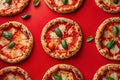Mini pepperoni pizzas on red background. Top view, flatlay composition. Generative Ai Royalty Free Stock Photo