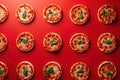 Mini pepperoni pizzas on red background. Top view, flatlay composition. Generative Ai Royalty Free Stock Photo