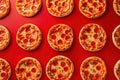 Mini pepperoni pizzas on red background. Top view, flatlay composition. Generative Ai Royalty Free Stock Photo