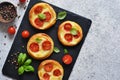 Mini pie with tomatoes and cheese. Quiche with vegetables and sauce top view