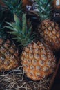 Mini pineapples on sale at a street market in London, UK