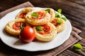 Mini pizzas with Camembert and tomato Royalty Free Stock Photo