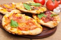 Mini pizzas on a cutting board Royalty Free Stock Photo