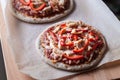 Mini pizzas on a cutting board Royalty Free Stock Photo