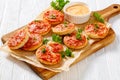 Mini pizzas with ham and pecorino cheese, top view