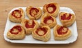 Mini Pizzas with Mozzarella on wooden table