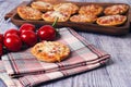 Mini pizzas on a wooden table Royalty Free Stock Photo