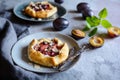 Mini plum galettes with almond slices