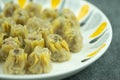 Mini pork Dim Sum on a white dish Royalty Free Stock Photo