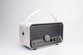 Mini portable radio amplifier with handle, multiple control buttons and ports, white color with perforated speaker patterns. m Royalty Free Stock Photo