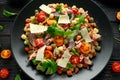 Mini potato gnocchi tricolour with tomato, spinach, Seasonal salad leaves and parmesan cheese