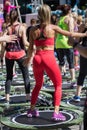 Mini Rebounder Workout - Girls doing Fitness Exercise in Class at Gym with Music and Teacher on Stage Royalty Free Stock Photo