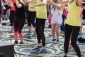 Mini Rebounder Workout - Girls doing Fitness Exercise in Class at Gym with Music and Teacher on Stage