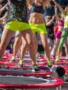 Mini Rebounder Workout: Girls doing Fitness Exercise in Outdoor Class at Gym