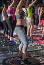 Mini Rebounder Workout: Girls doing Fitness Exercise in Outdoor Class at Gym