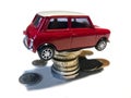 Mini red toy car on coins stack Royalty Free Stock Photo
