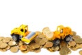 Mini Road roller machine with pile of gold coin, isolated on white background with copy space, business finance and banking indus Royalty Free Stock Photo