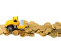 Mini Road roller machine with pile of gold coin, isolated on whi Royalty Free Stock Photo