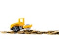 Mini Road roller machine with stack coin with pile of gold coin, isolated on white background with copy space, business finance Royalty Free Stock Photo