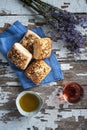 Mini rustic bread with lavand flower on the side, olive oil and rose wine