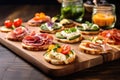 mini sandwiches with different cold cuts on an oak board Royalty Free Stock Photo