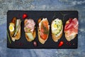 Mini sandwiches food set. Brushetta or authentic traditional spanish tapas for lunch table. Delicious snack, appetizer, antipasti Royalty Free Stock Photo