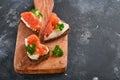 Mini sandwiches with salmon, curd cheese, parsley and rye bread in form of hearts. Valentine`s day homemade creative food. Love