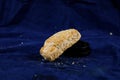 Mini Sausage Puff isolated on blue background side view of savory snack food