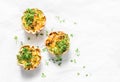 Mini savory pie with chicken, leek, cheese on light background, top view. Delicious appetizer, snack, breakfast