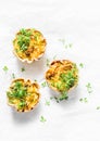 Mini savory pie with chicken, leek, cheese on light background, top view. Delicious appetizer, snack, breakfast Royalty Free Stock Photo